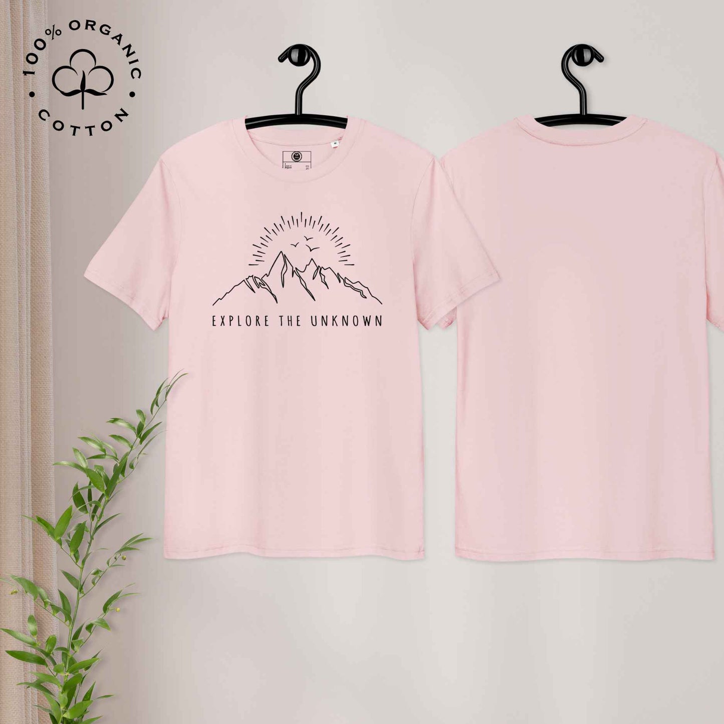 Eco-friendly -shirt with with mountain design and 'Explore the Unknown' text.