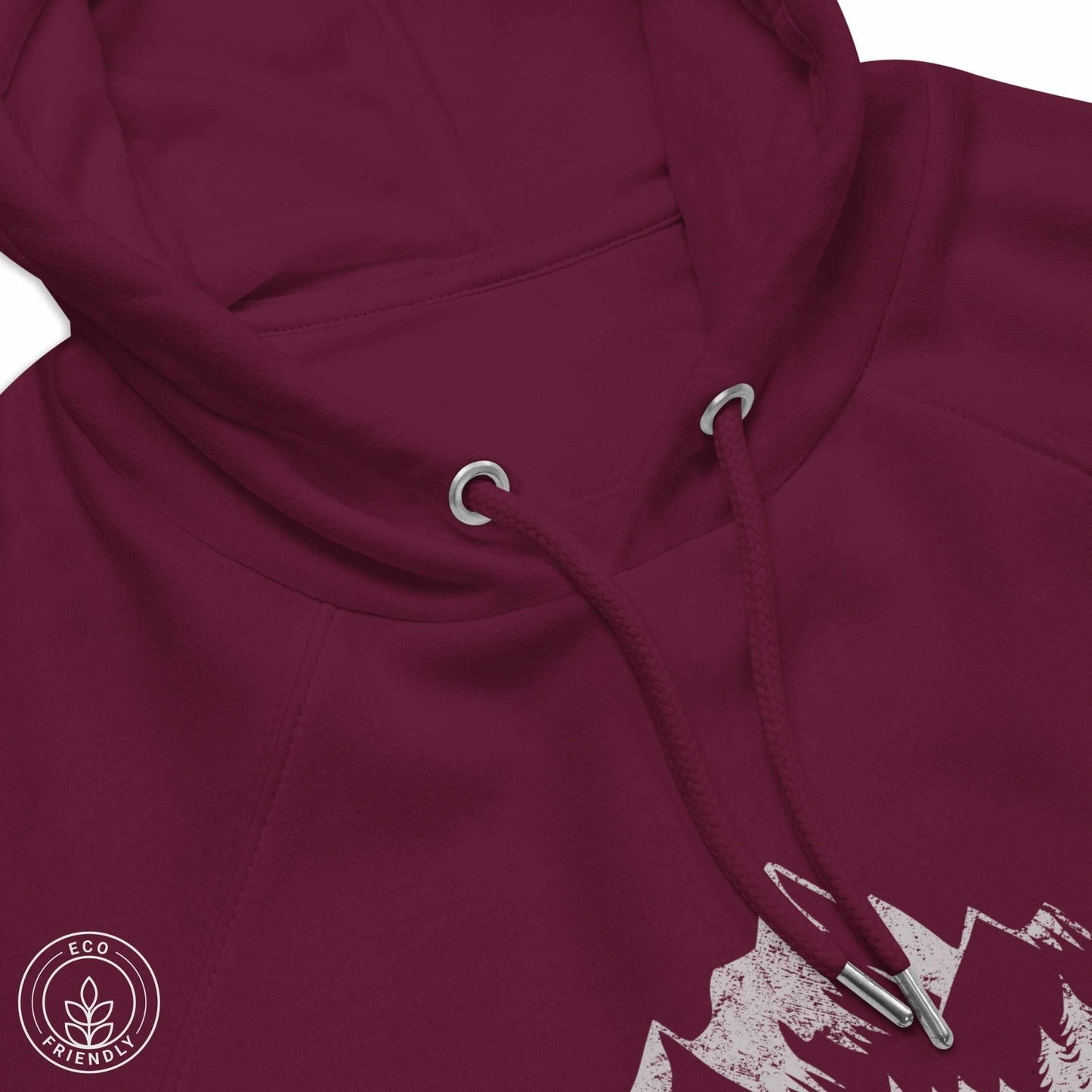 Close-up burgundy eco-friendly hoodie featuring forest, mountain and compass design and 'escape to wilderness' graphic text on a white background