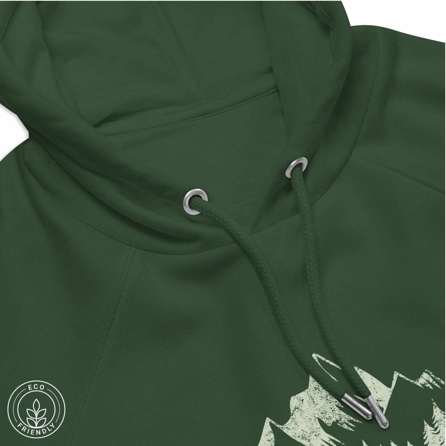 close-up Green eco-friendly hoodie featuring forest, mountain and compass design and  'Escape to Wilderness' graphic text