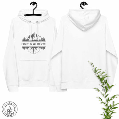 White eco-friendly hoodie featuring forest, mountain and compass design and  'Escape to Wilderness' graphic text on a hanger with greenery.