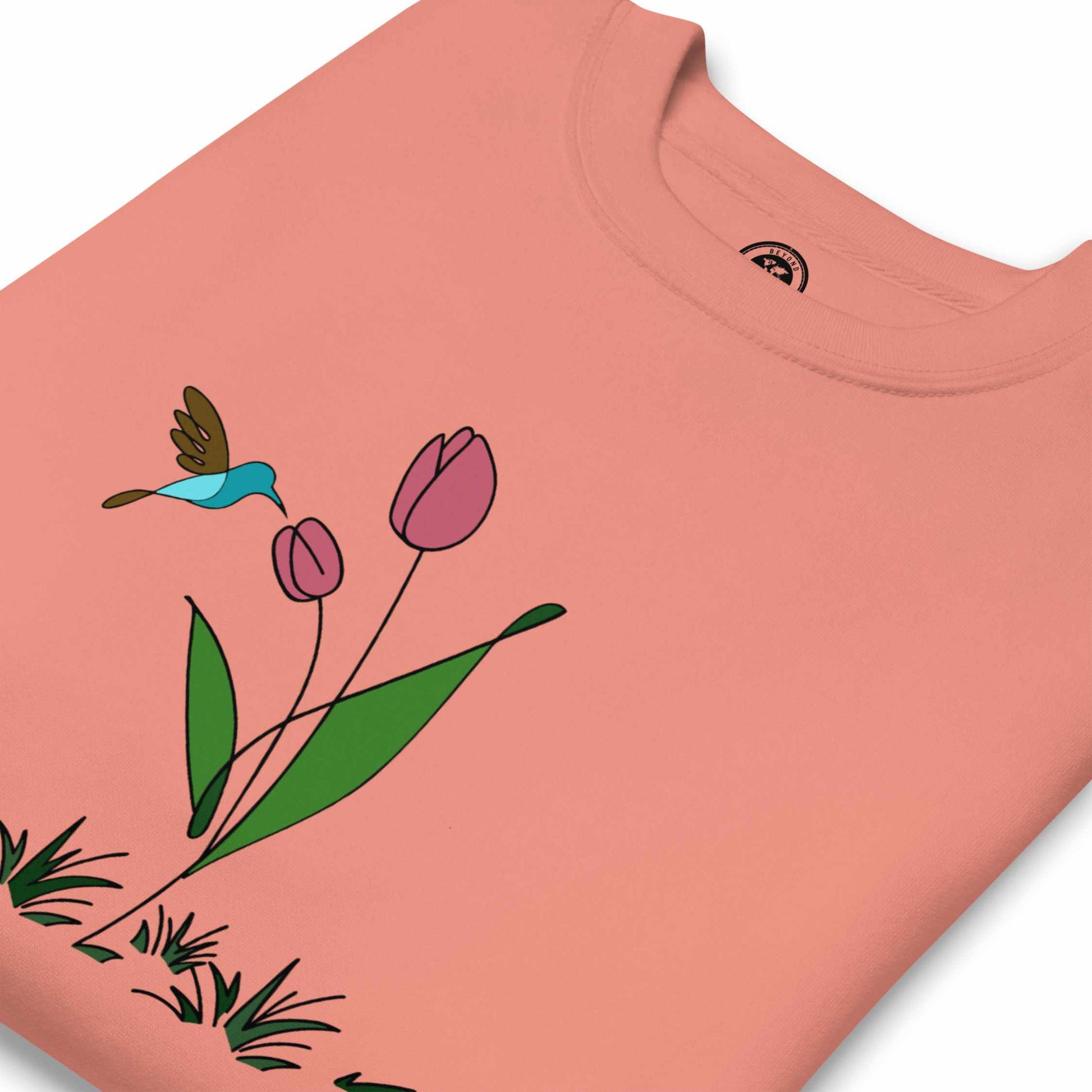 Rose sweatshirt with a floral design featuring tulips and hummingbird and on a white background