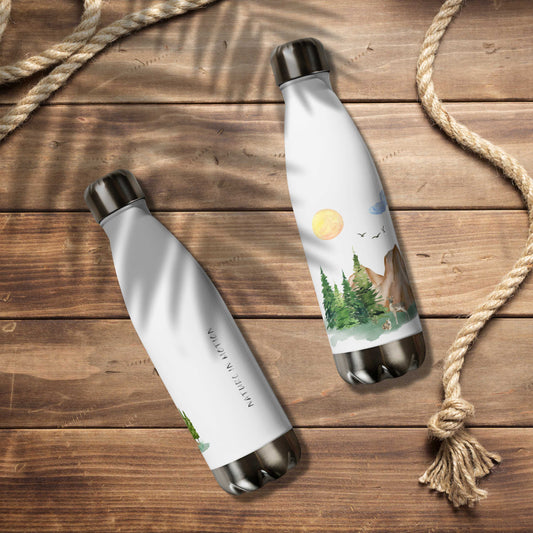 Stainless steel water bottles 17 oz (500 ml), insulated, with nature-themed designs, forest, mountain, rocks and animals, on a wooden surface.