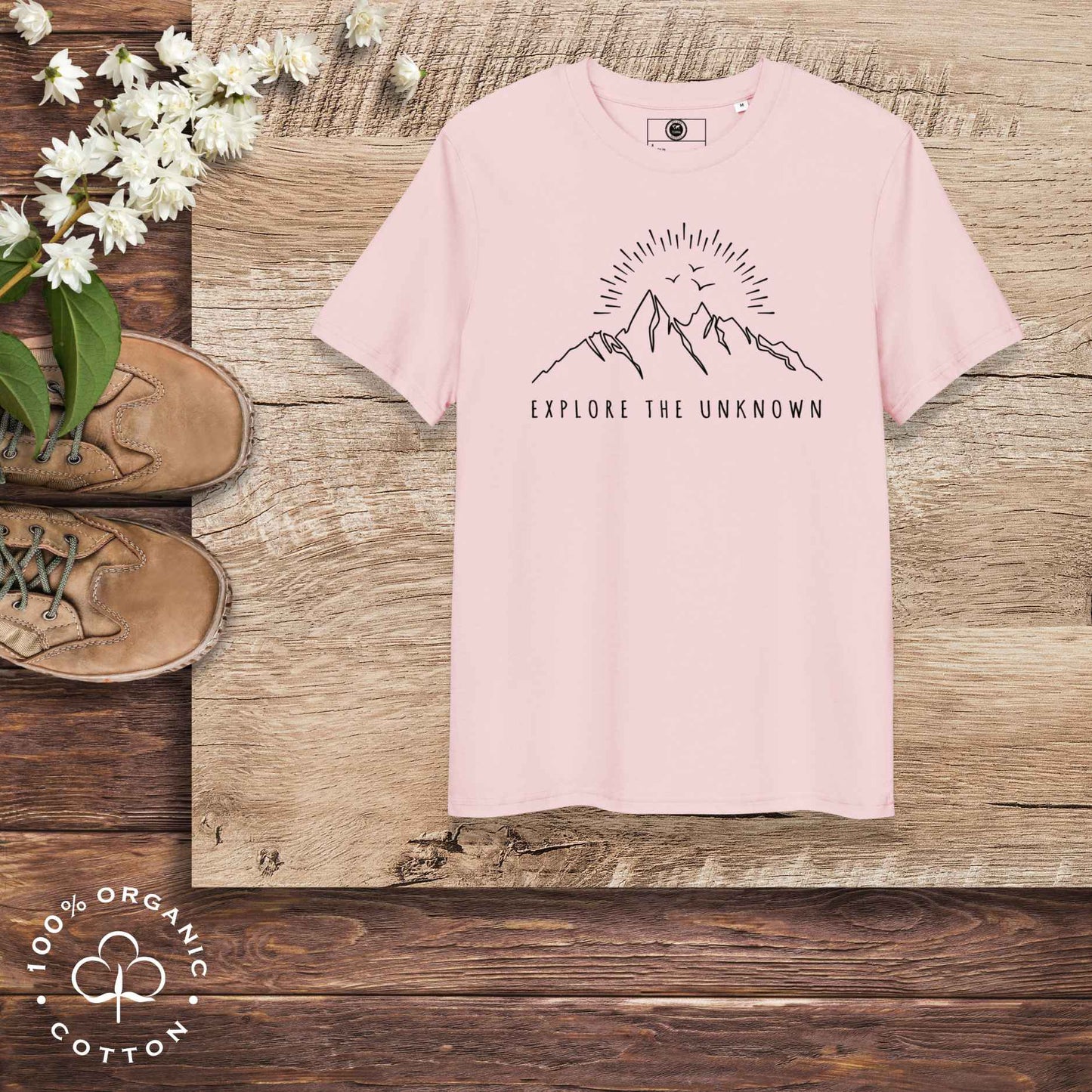 Eco-friendly -shirt with  with mountain design and 'Explore the Unknown' text.