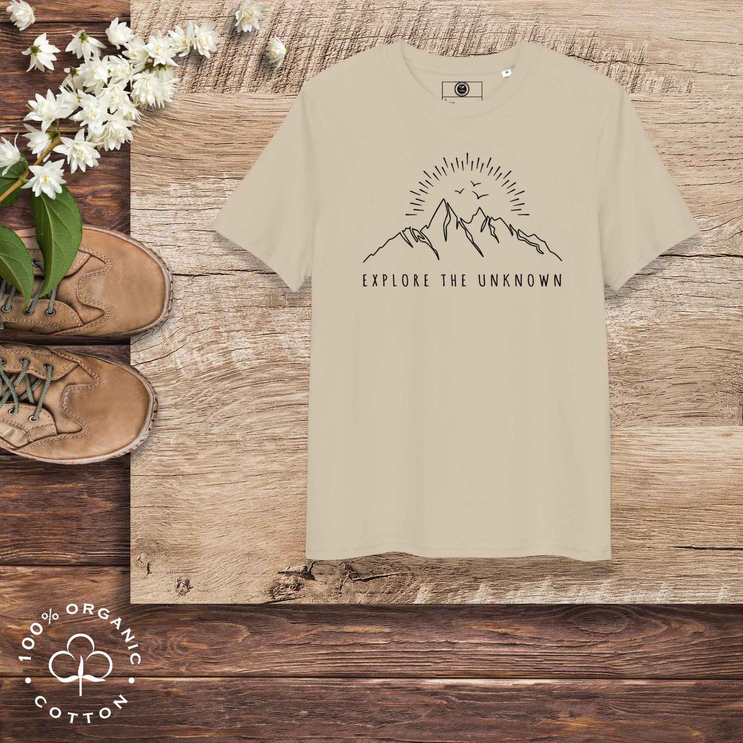 Eco-friendly -shirt with  with mountain design and 'Explore the Unknown' text.