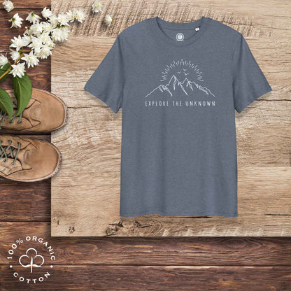 Eco-friendly -shirt with  with mountain design and 'Explore the Unknown' text.