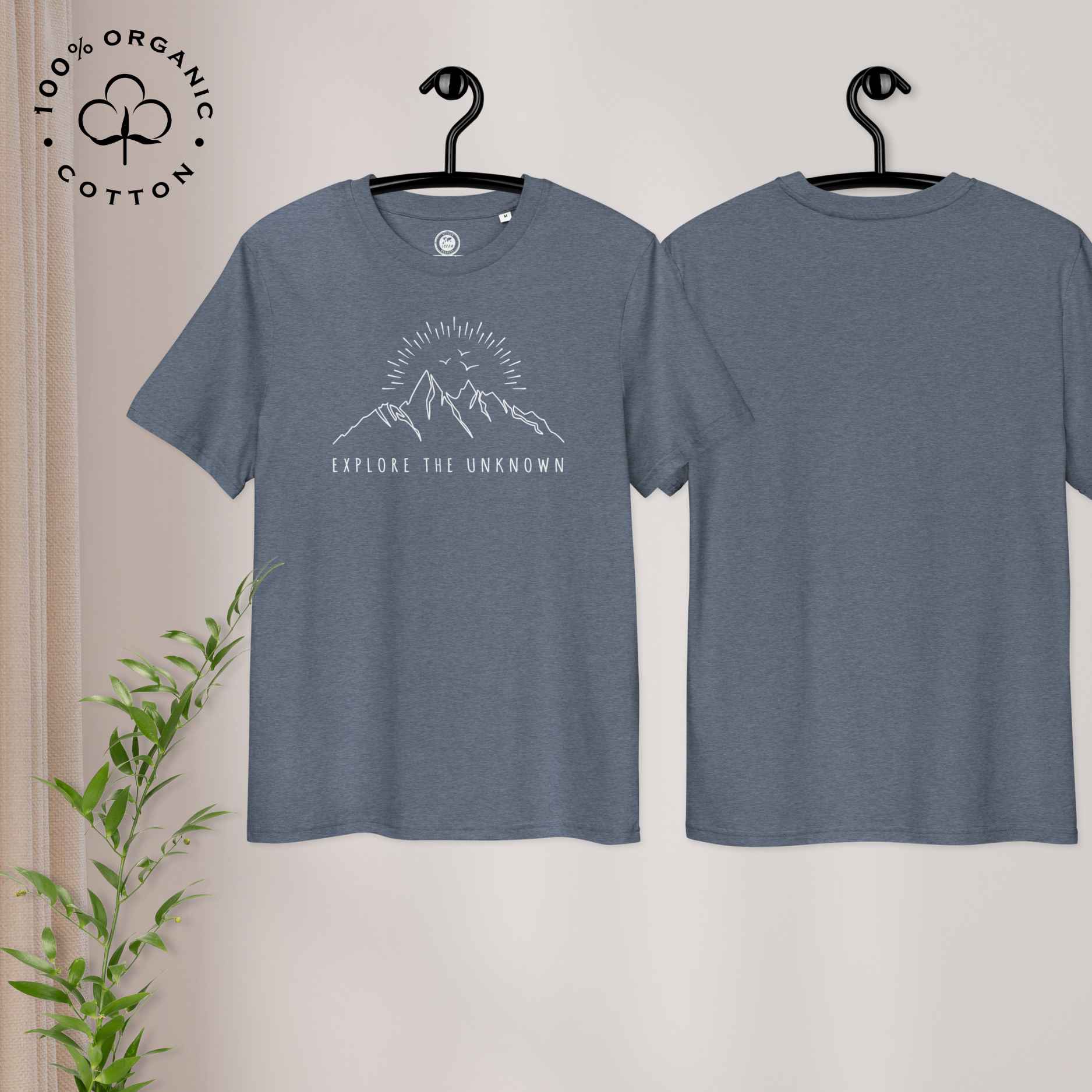 Eco-friendly -shirt with  with mountain design and 'Explore the Unknown' text.