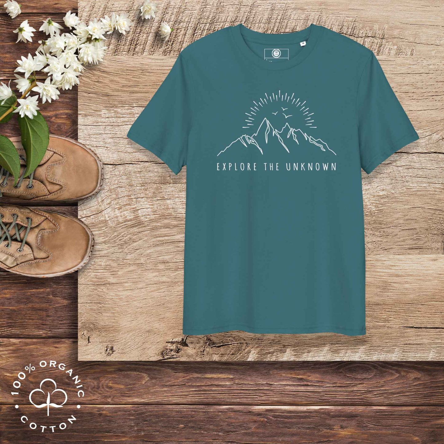Eco-friendly -shirt with  with mountain design and 'Explore the Unknown' text.