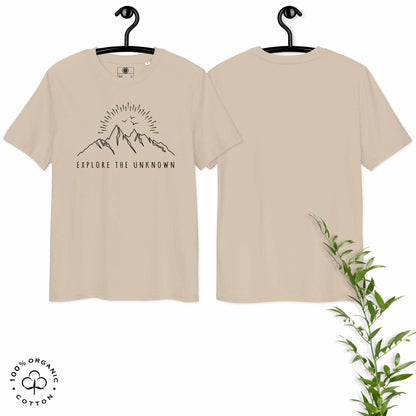 desert organic cotton t-shirt with mountain, sun and birds graphic and 'Explore the Unknown' text  hanged on a white background