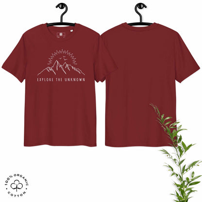 Hanged burgundy organic cotton t-shirt with mountain, sun and birds graphic and 'Explore the Unknown' text  on a white background