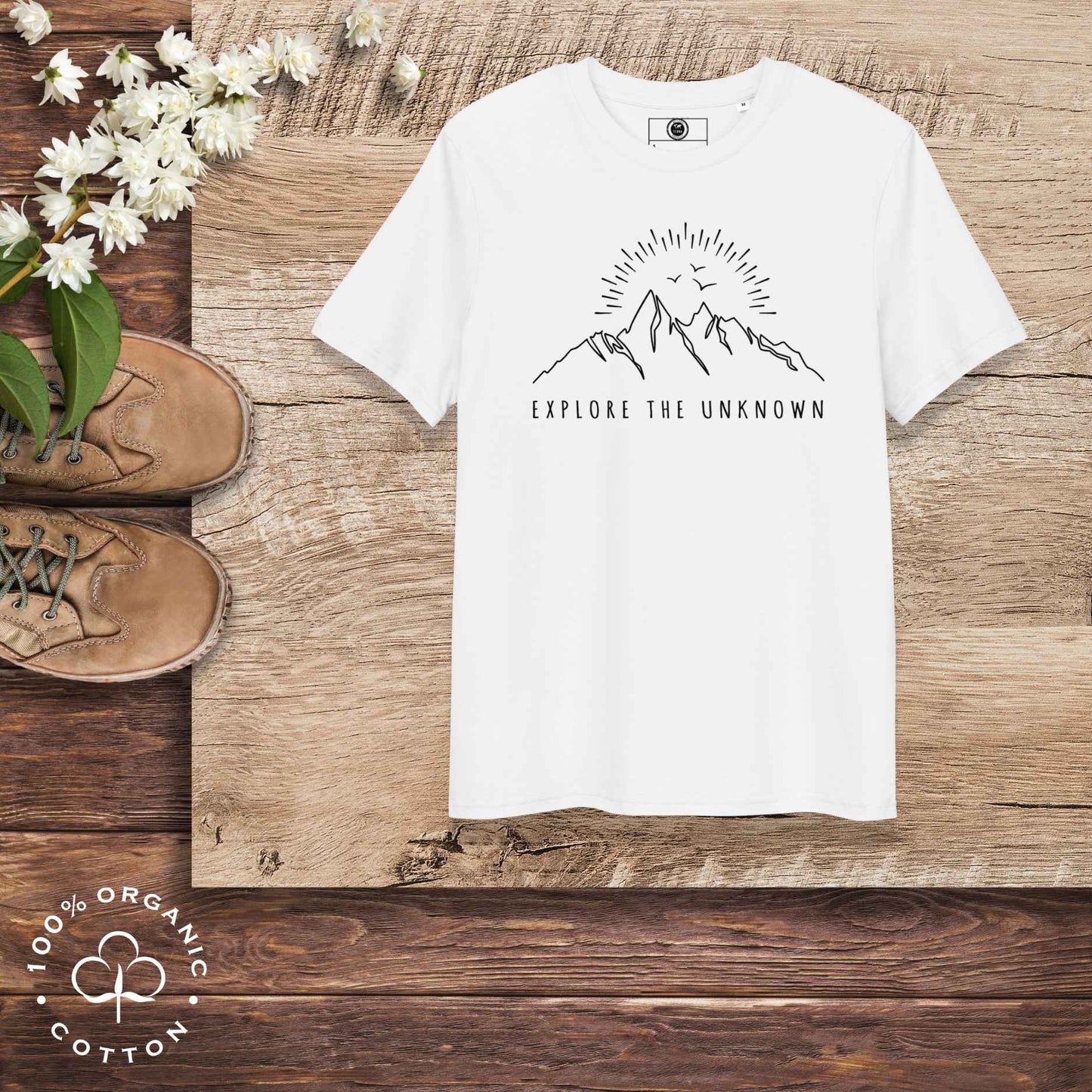Eco-friendly -shirt with  with mountain design and 'Explore the Unknown' text.