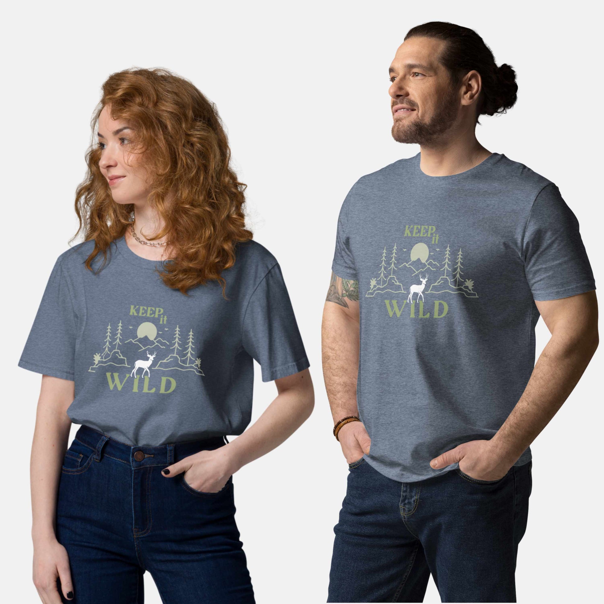 man and woman wearing dark heather blue organic t-shirt with 'Keep it Wild' bold and deer, mountain, forest graphic design