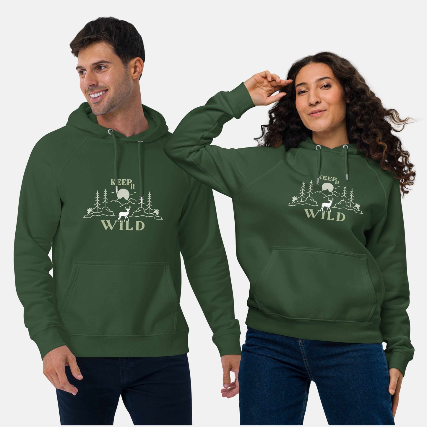 Man and woman wearing green eco hoodie with 'Keep it Wild' bold and deer, mountain, forest graphic design