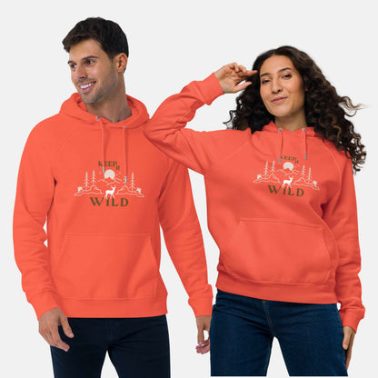 Man and woman wearing orange eco hoodie with 'Keep it Wild' bold and deer, mountain, forest graphic design
