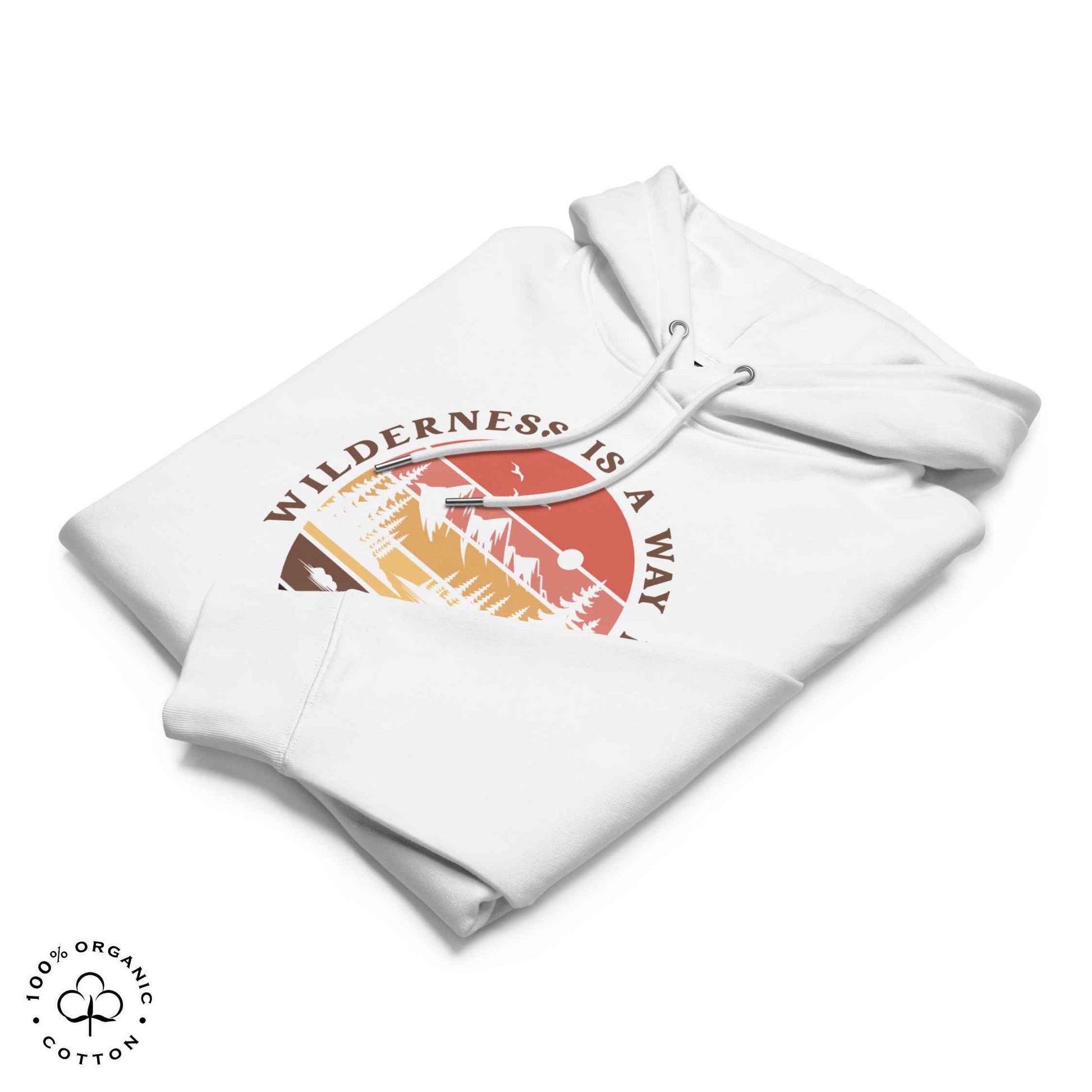 Folded white organic cotton hoodie with nature-themed graphic, mountain, forest, sun and river. With bold Wilderness is a way home, where I belong. 