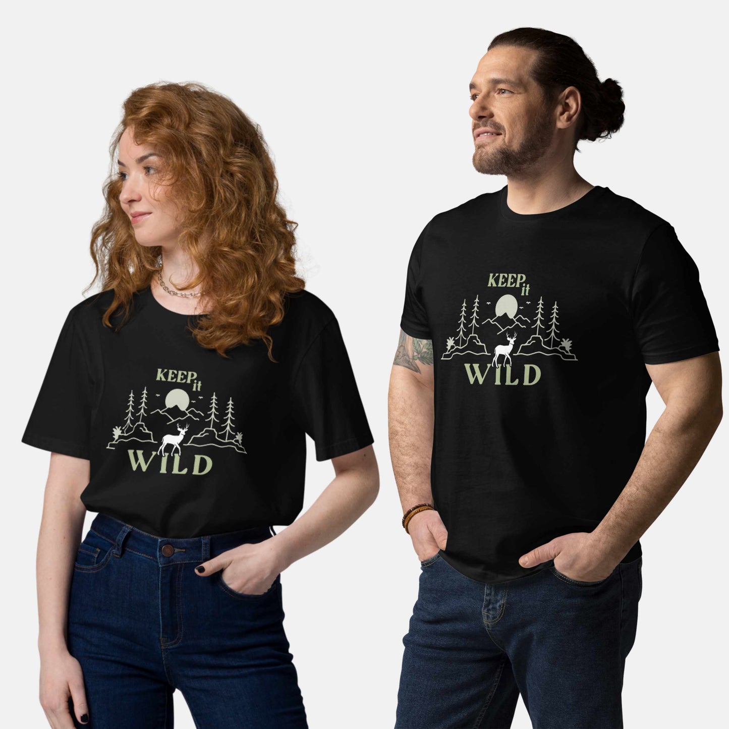 man and woman wearing black organic t-shirt with 'Keep it Wild' bold and deer, mountain, forest graphic design