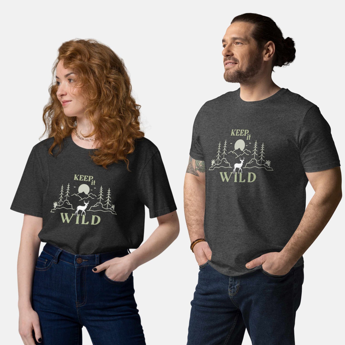 man and woman wearing dark grey organic t-shirt with 'Keep it Wild' bold and deer, mountain, forest graphic design