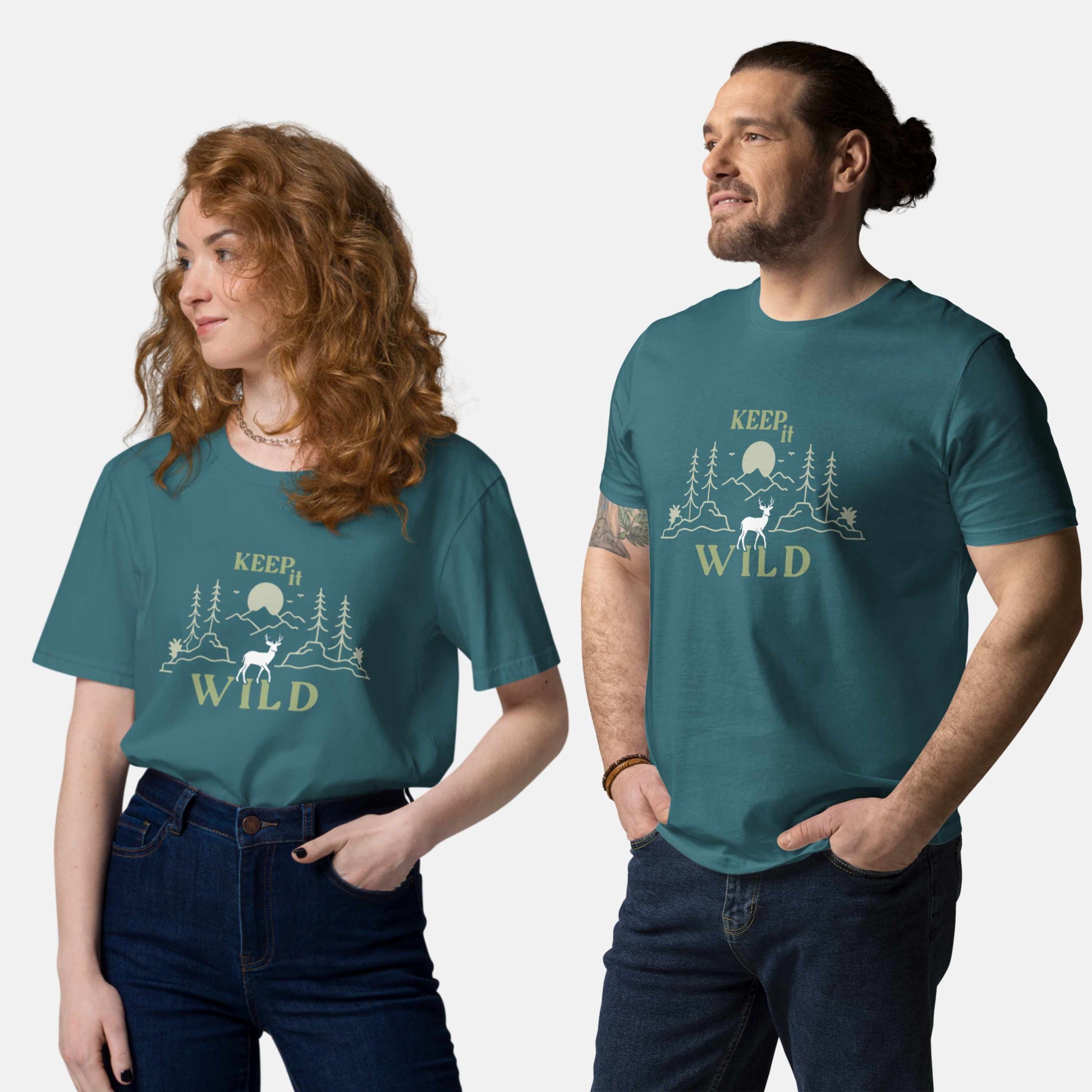 Man and woman wearing stargazer organic t-shirt with 'Keep it Wild' bold and deer, mountain, forest graphic design