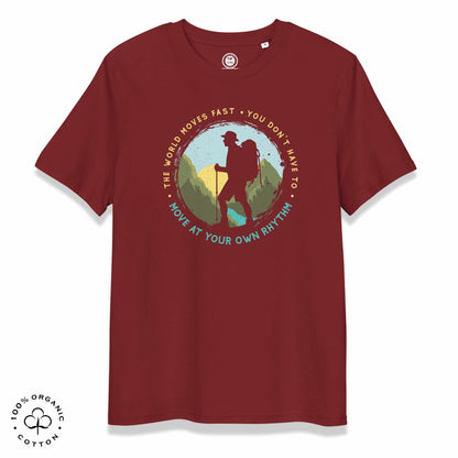 Maroon organic cotton t-shirt with a hiking graphic design and text "Move at your own rhythm" on a white background