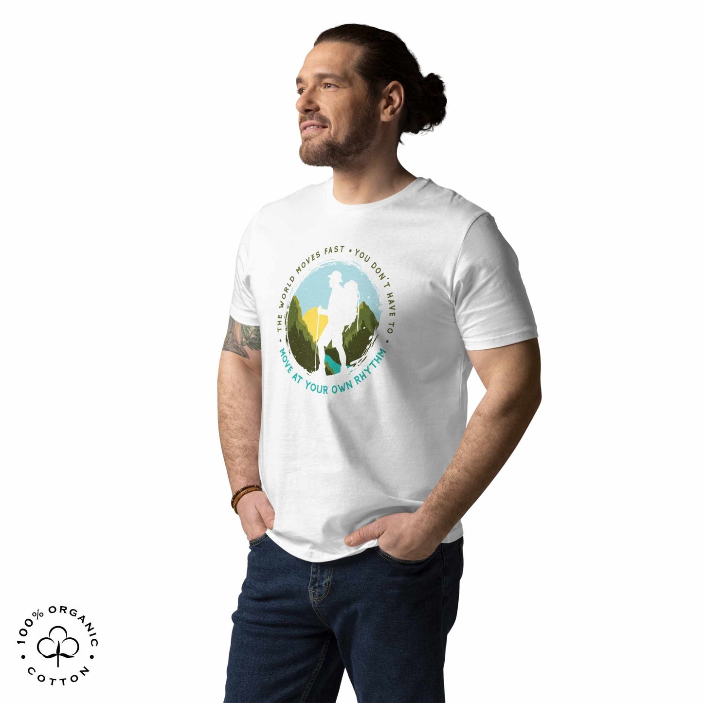 Man wearing White organic cotton t-shirt with a hiking graphic design and text "Move at your own rhythm" on a white background