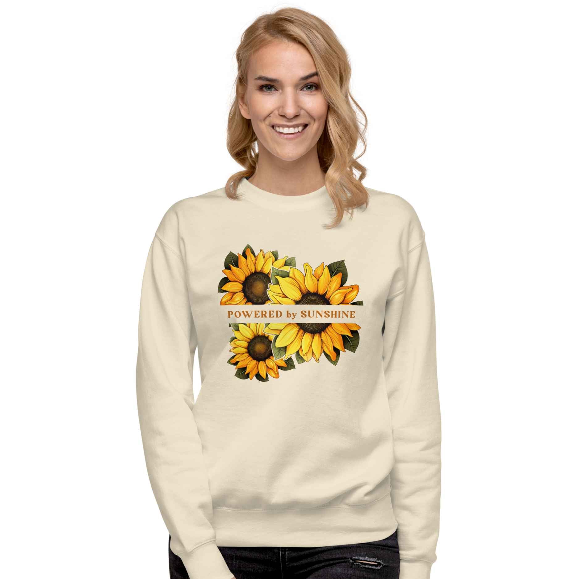 Woman sweatshirt with sunflower design and text Powered by Sunshine.