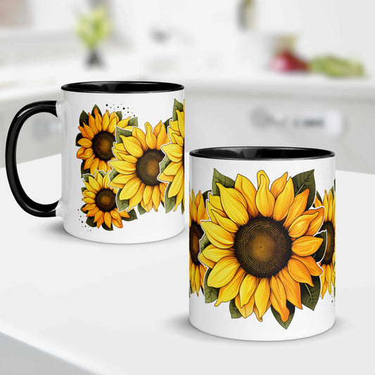 Two white mugs with sunflower designs on a white surface.
