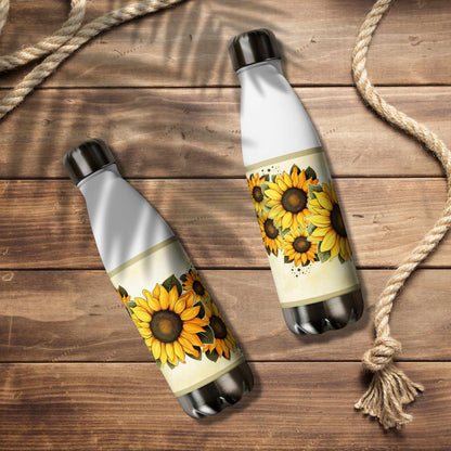 Two water bottle stainless steel with sunflower designs on a wooden surface.