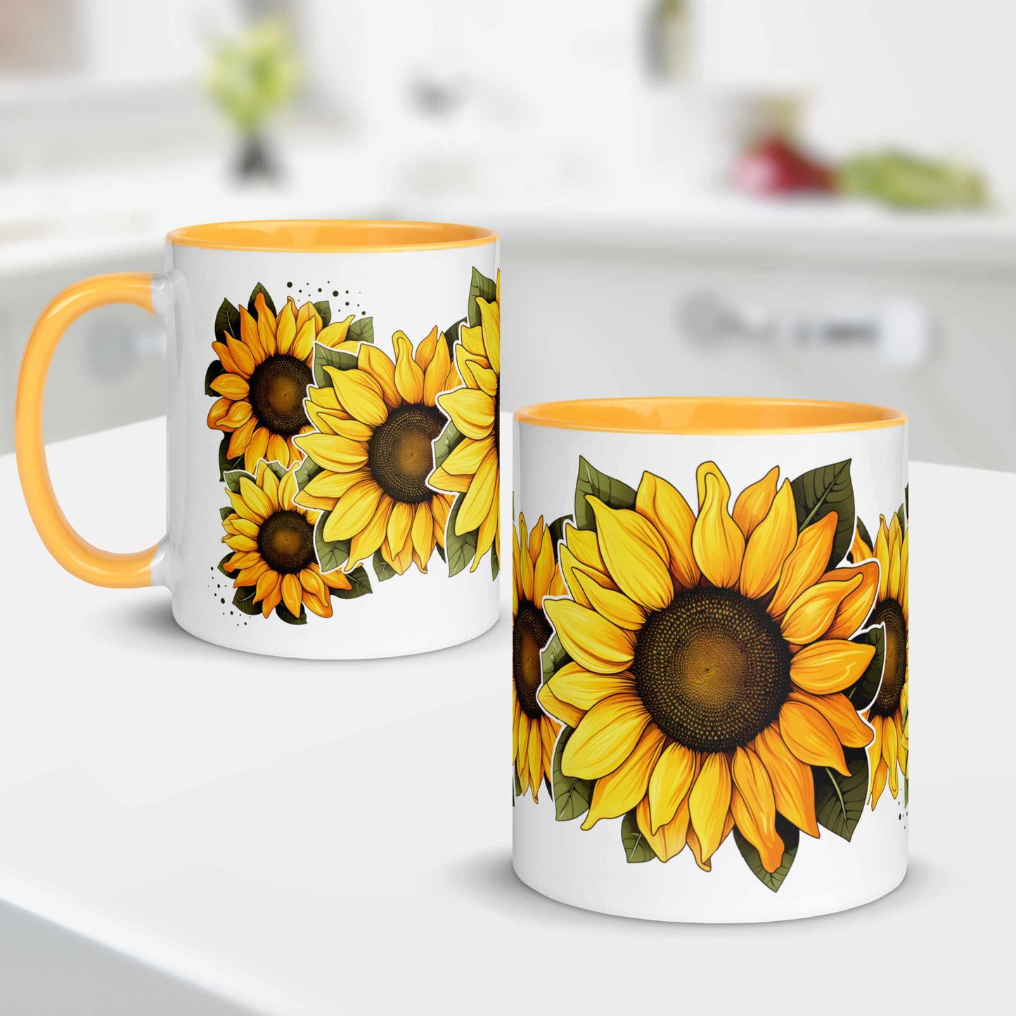 White and yellow ceramic mug with sunflower designs, yellow handles, on a white surface and kitchen blur background