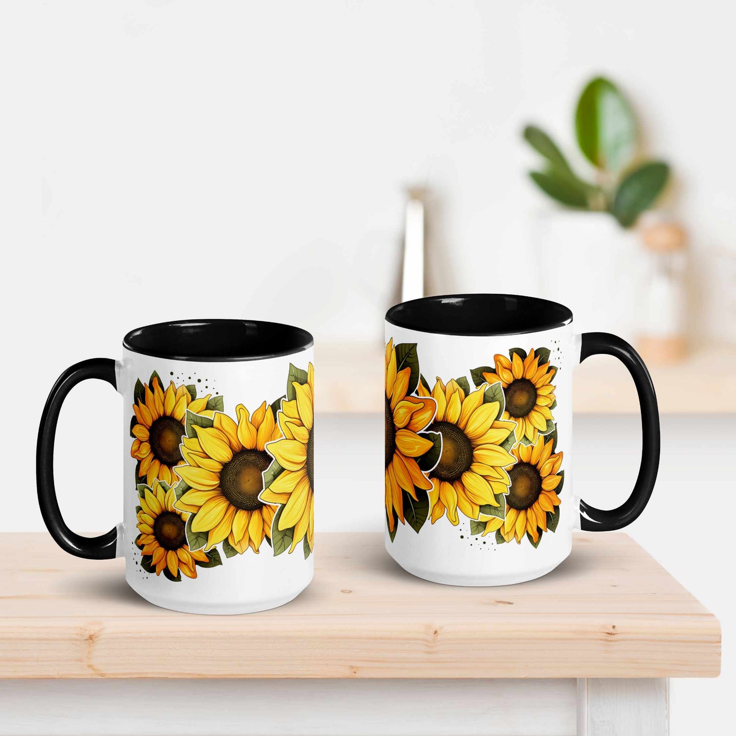 White and black ceramic mug with black handle featuring sunflower design on a wooden surface