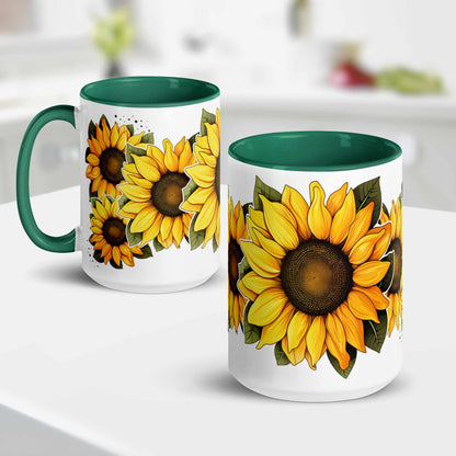 White and green ceramic mug 15 oz with green handle featuring sunflower designs on a white surface and kitchen background
