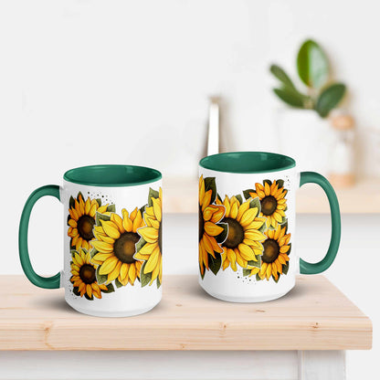 White and green ceramic mug 15 oz with green handle featuring sunflower design on a wooden surface