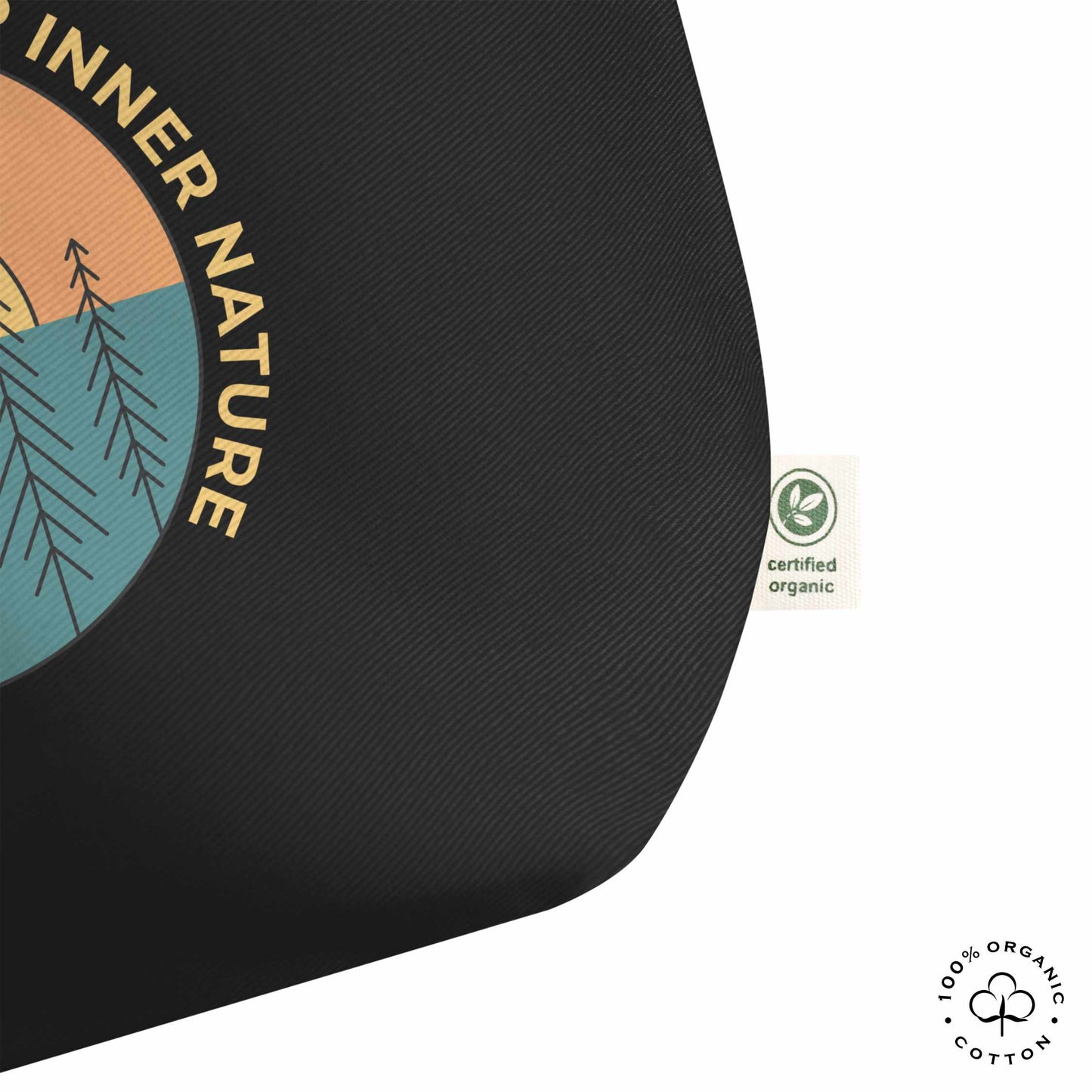 Close-up black organic cotton tote bag with nature-themed design featuring sun and trees and 'Connect with Your Inner Nature' text on a white background.