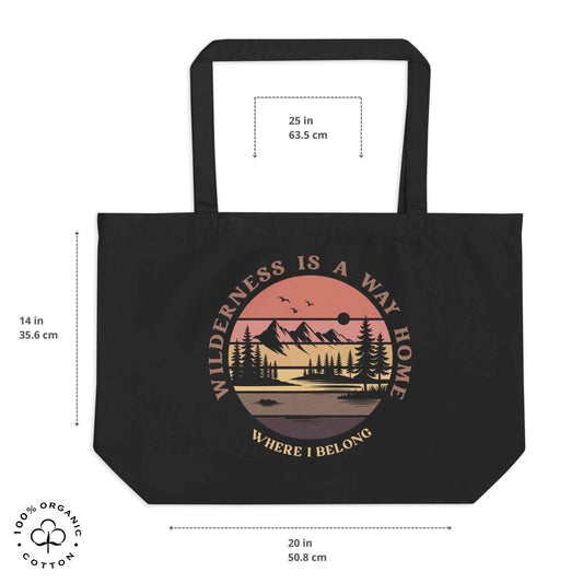 Black organic cotton large tote bag with nature-themed design: forest, trees, sun, lake. 'Wilderness is a Way Home, Where I belong' text. 