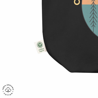Close-up black organic cotton medium tote bag with nature-themed design featuring sun and trees and 'Connect with Your Inner Nature' text on a white background.