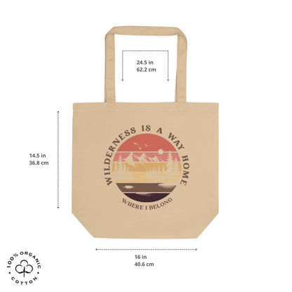 Oyster organic cotton medium tote bag with nature-themed design: forest, trees, sun, lake. 'Wilderness is a Way Home, Where I belong' text. 